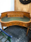 AN EARLY 20th C. SWAG INLAID SATIN WOOD CARLTON HOUSE DESK, THREE DRAWERS WITHIN THE CURVE OF THE