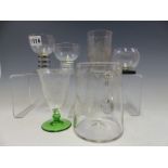 A LALIQUE GLASS WITH A BLACK CHEQUER STEM, THREE OTHER GLASSES, AN 1894 ANVERS EXHIBITION TUMBLER, A