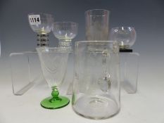 A LALIQUE GLASS WITH A BLACK CHEQUER STEM, THREE OTHER GLASSES, AN 1894 ANVERS EXHIBITION TUMBLER, A