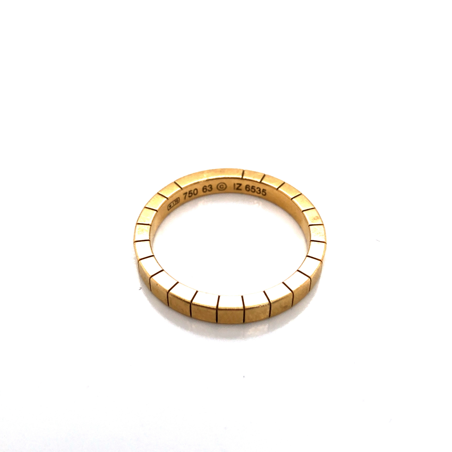 A VINTAGE CARTIER LANIERES BRICK LINK BAND RING. THE RING STAMPED 750, 63, 12, 6535. FINGER SIZE
