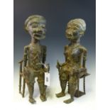 A LATE 19th C. BENIN BRONZE KING AND QUEEN SEATED ON A THRONE AND A STOOL RESPECTIVELY AND HOLDING