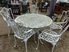 A PAINTED PATIO TABLE AND FIVE CHAIRS