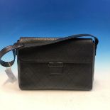 A CHANEL BLACK ON BLACK LEATHER SHOULDER FLAP BAG. W 30 x H 23 cms