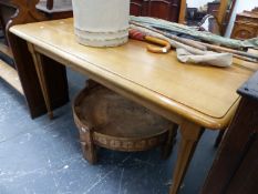 A 20th C. OAK TABLE, THE RECTANGULAR TOP OF FLUTED TAPERING CYLINDRICAL LEGS. W 134 x D 89 x H