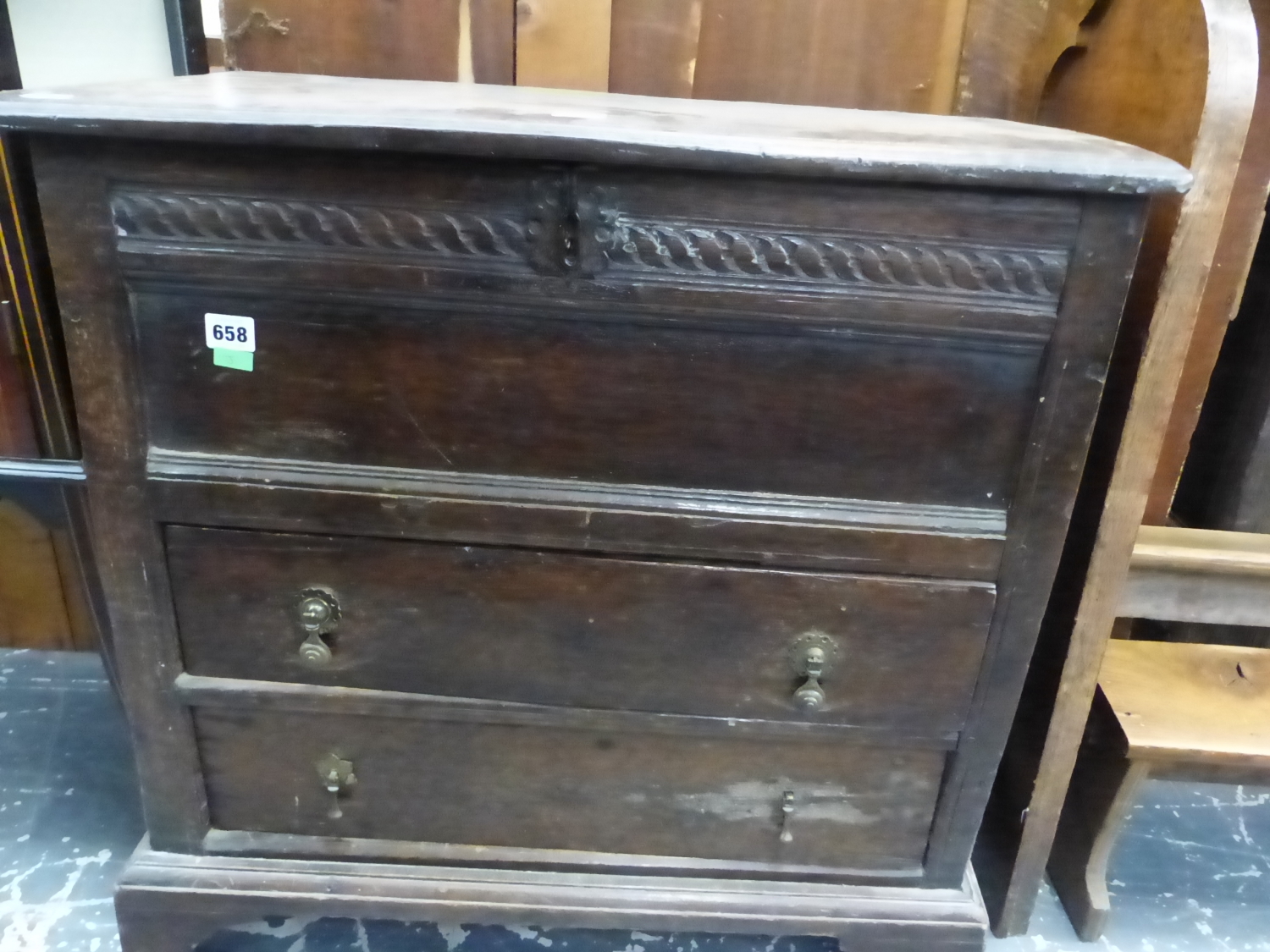 AN EARLY OAK COFFER TOPPED CHEST OF TWO DRAWERS ON BRACKET FEET. W 69 x D 39 x H 68cms.