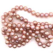 TWO STRANDS OF CULTURED BAROQUE PEARLS. ONE CREAM / WHITE THE OTHER PINK. WHITE LENGTH 116cms,
