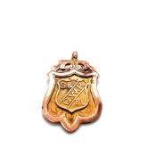 A 9ct HALLMARKED ROSE GOLD FOB PENDANT. DATED 1930, BIRMINGHAM. THE FRONT WITH SMALLER SHIELD,