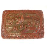 A CHINESE CINNABAR LACQUER BOX, THE BASE AND TOP WITH FIGURES IN RELIEF WALKING WALLED PATHS