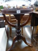 A 20th C. MAHOGANY FLAP TOP COFFEE TABLE TOGETHER WITH A MAHOGANY TRIPOD GLOBE STAND