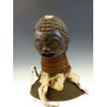 A 19th C. YORUBA DANCE OF THE HUNTER HEADDRESS, THE HEAD WITH TINTED COLOURS TO THE FACE, BARK