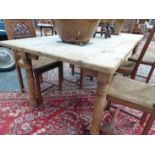 AN ANTIQUE AND LATER PINE SCRUB TOP FARM KITCHEN TABLE. L 211 H. 77. D. 95cms