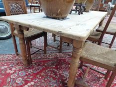 AN ANTIQUE AND LATER PINE SCRUB TOP FARM KITCHEN TABLE. L 211 H. 77. D. 95cms