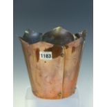 A W A S BENSON COPPER PLANTER FORMED OF SIX RIVETTED PETAL TOPPED PANELS TAPERING TO A CIRCULAR