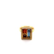 AN ANDREW GEOGHEGAN, CHOCOLATE BOX ORIGINAL RING. A CUBIST ART RING WITH A TRIO OF GEMSTONES TO