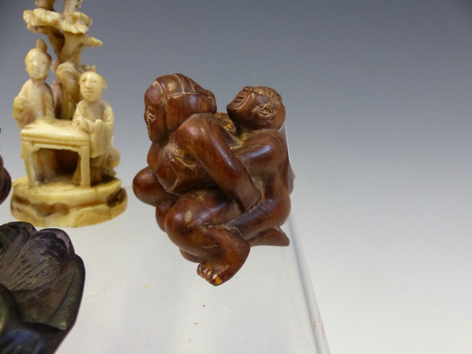 AN IVORY OKIMONO OF TWO LADIES BY A TABLE UNDER A TREE. H 7cms. THREE WOODEN NETSUKES TOGETHER - Image 3 of 6