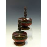 A PAIR OF AFRICAN PAINTED TURNED WOOD BOWLS WITH COUCHING FIGURE COVER FINIALS, Dia. 13cms.