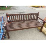 A TEAK GARDEN BENCH. H 89 x W 157 x D 62cms