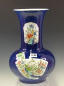 A CHINESE POWDERED BLUE GROUND VASE, A FLARED RIM TO THE TALL CYLINDRICAL NECK ON A BUN SHAPED