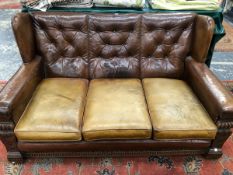 A MID 20th C. THREE PIECE SUITE BUTTON BACK UPHOLSTERED IN BROWN LEATHER, THE CUSHION SEATS OF PALER