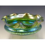 ATTRIBUTED TO LOETZ, A SPLASHED IRIDESCENT GREEN GLASS PAPILLON BOWL WITH PETAL SHAPED RIM. Dia.