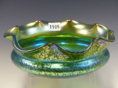 ATTRIBUTED TO LOETZ, A SPLASHED IRIDESCENT GREEN GLASS PAPILLON BOWL WITH PETAL SHAPED RIM. Dia.