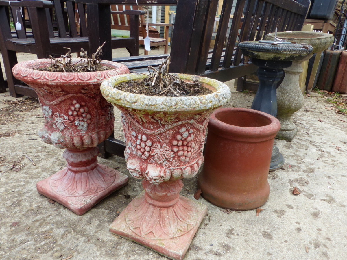 A PAIR OF PAINTED CLASSICAL STYLE COMPOSITE GARDEN URNS TOGETHER WITH A BIRD BATH, SUNDIAL ETC