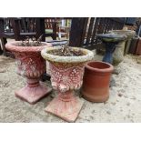 A PAIR OF PAINTED CLASSICAL STYLE COMPOSITE GARDEN URNS TOGETHER WITH A BIRD BATH, SUNDIAL ETC