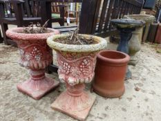 A PAIR OF PAINTED CLASSICAL STYLE COMPOSITE GARDEN URNS TOGETHER WITH A BIRD BATH, SUNDIAL ETC