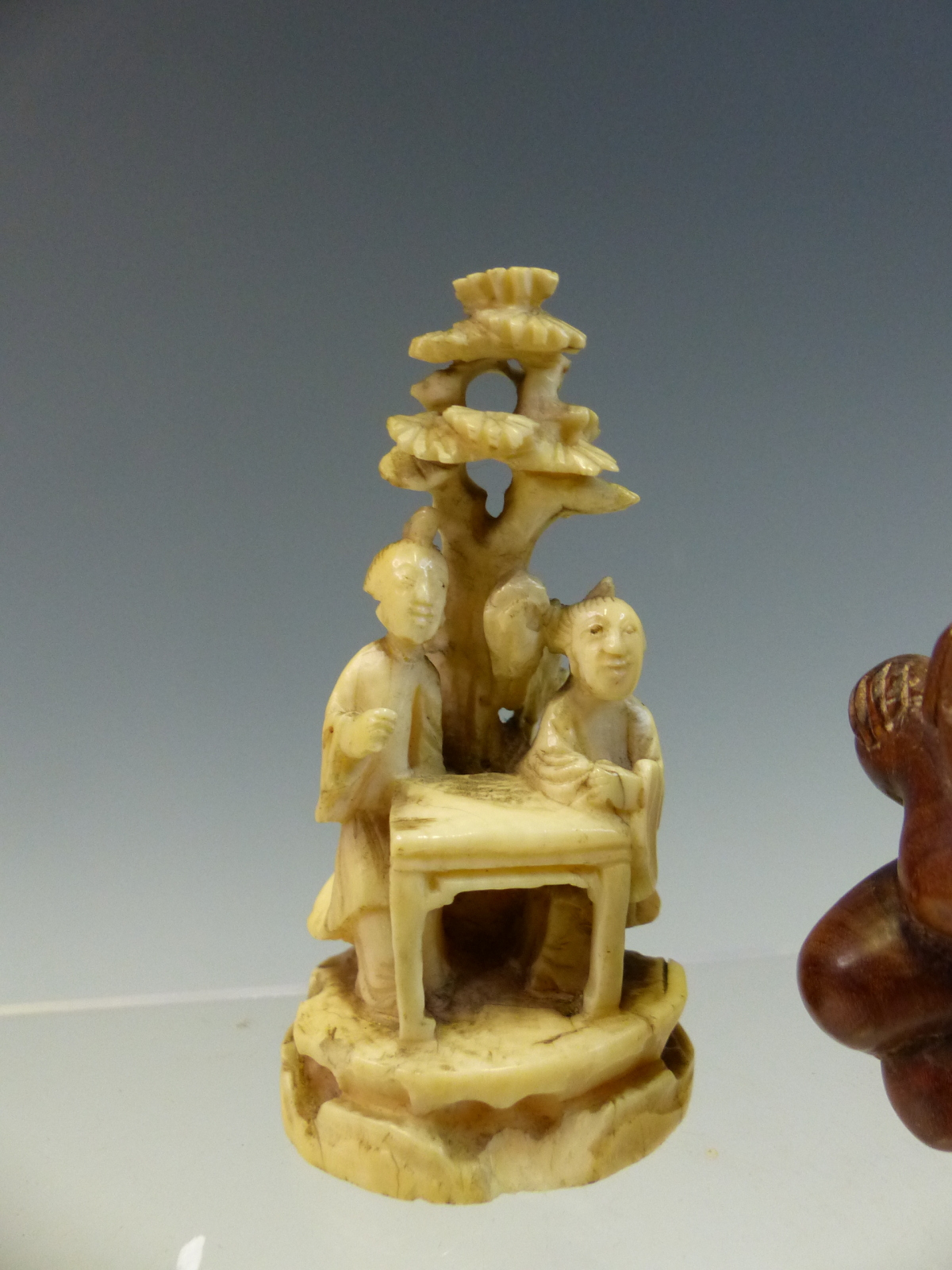 AN IVORY OKIMONO OF TWO LADIES BY A TABLE UNDER A TREE. H 7cms. THREE WOODEN NETSUKES TOGETHER - Image 5 of 6