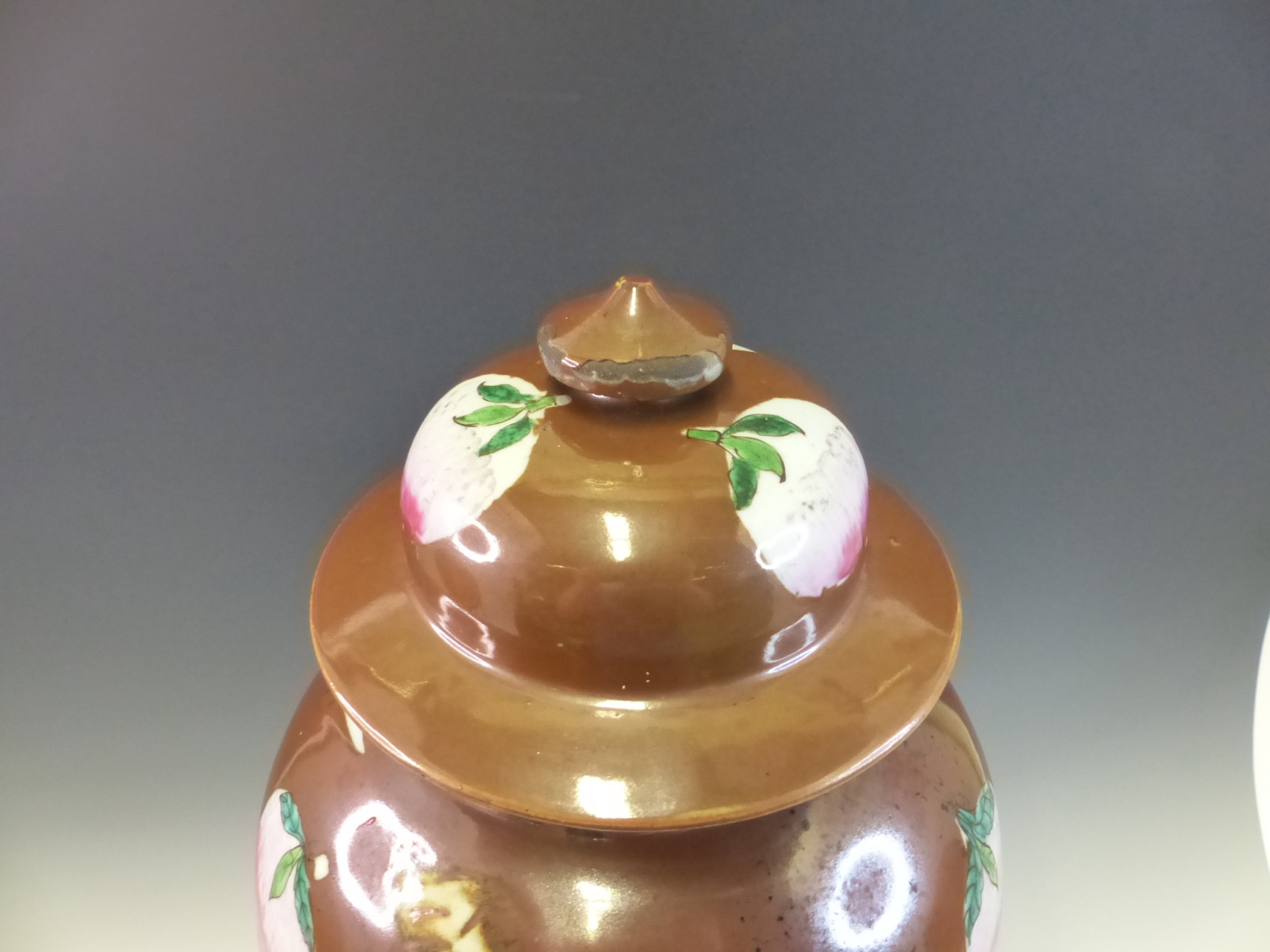 A CHINESE BALUSTER VASE AND COVER PAINTED IN FAMILLE ROSE ENAMELS WITH PEACHES AND LEAF SHAPED - Image 2 of 9