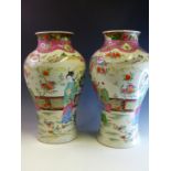 A PAIR OF FAMILLE ROSE DECORATED BALUSTER VASES, SIX CHARACTER MARK TO BASES H 39cms