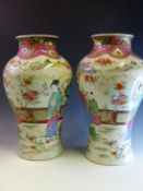 A PAIR OF FAMILLE ROSE DECORATED BALUSTER VASES, SIX CHARACTER MARK TO BASES H 39cms