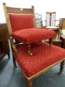 A LATE VICTORIAN MAHOGANY ARMCHAIR AND A LATER FOOTSTOOL UPHOLSTERED EN SUITE