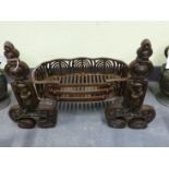 A VINTAGE WROUGHT IRON FIRE FENDER W104CM TOGETHER WITH AN UNUSUAL GRATE AND A PAIR OF SIMILAR
