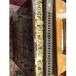 A GREY PAINTED IRON RACK TOGETHER WITH PIERCED BRASS LETTERS AND NUMBERS