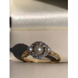A HALLMARKED 18ct GOLD DIAMOND AND PEARL VICTORIAN STYLE RING. FINGER SIZE O. WEIGHT 3.09grms.