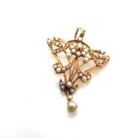 AN ANTIQUE ART NOUVEAU SEED PEARL PENDANT. STAMPED TO REVERSE 15ct ASSESSED AS 15ct GOLD. DROP 5cms,