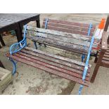 A PAIR OF SMALL GARDEN BENCHES WITH PAINTED IRON ENDS. H 68 x W 123 x D 51cms