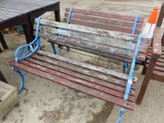 A PAIR OF SMALL GARDEN BENCHES WITH PAINTED IRON ENDS. H 68 x W 123 x D 51cms