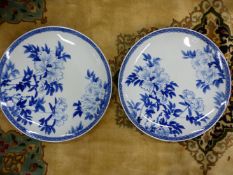 A PAIR OF JAPANESE LARGE BLUE AND WHITE SAUCER DISHES DECORATED WITH FLOWERS SEAL MARK D 46cms (2)