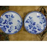 A PAIR OF JAPANESE LARGE BLUE AND WHITE SAUCER DISHES DECORATED WITH FLOWERS SEAL MARK D 46cms (2)