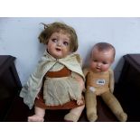 AN ARMAND MARSEILLE DOLL WITH COMPOSITION HEAD TOGETHER WITH ANOTHER DOLL, POSSIBLY BY HEUBACH