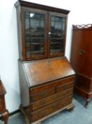 AN 18th C. AND LATER HERRING BONE LINE INLAID WALNUT BUREAU BOOKCASE, THE UPPER HALF WITH GLAZED