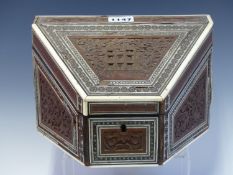 A 19th C. INDIAN INLAID AND CARVED WOOD STATIONERY BOX, A HOUSE CARVED ON THE SLOPING FRONT OF THE