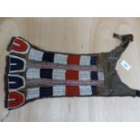 A BORAN TRIBE ANTELOPE HIDE BRIDAL APRON WITH FUR NECK STRAPS SEWN WITH RED, WHITE AND BLUE