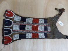 A BORAN TRIBE ANTELOPE HIDE BRIDAL APRON WITH FUR NECK STRAPS SEWN WITH RED, WHITE AND BLUE