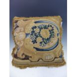 A CUSHION SEWN WITH 18th C. TAPESTRY WORK ON ONE SIDE TOGETHER WITH TWO OTHER DAMASK CUSHIONS