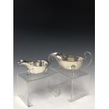 A SILVER TRIIFID FOOTED SAUCE BOAT BY WILLIAM NEALE, BIRMINGHAM 1925 WITH A GADROONED RIM TOGETHER