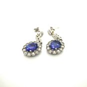 A PAIR OF TANZANITE AND DIAMOND CLUSTER DROP EARRINGS, UN-HALLMARKED, STAMPED 950, ASSESSED AS