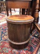 A MAHOGANY VICTORIAN COLUMNAR COMMODE WITH CERAMIC LINER BELOW THE HINGED CIRCULAR LID. Dia. 42 x